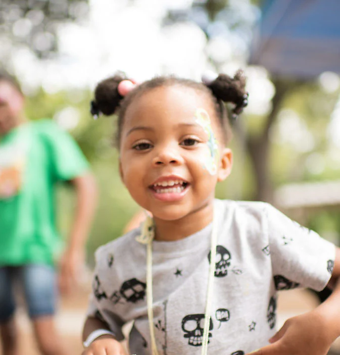 Child with face paint smiling at Dallas Zoo Member Brunch 2021