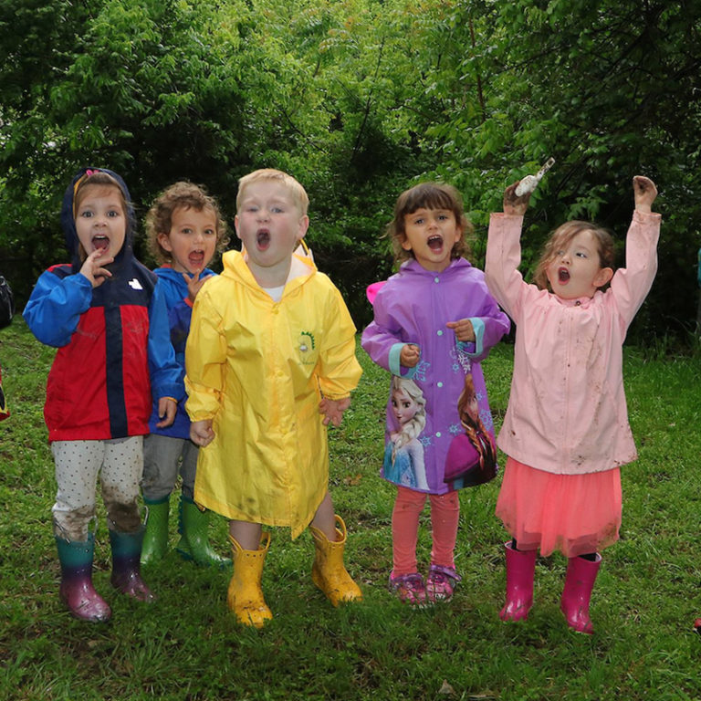 Children at the Dallas Zoo Wild Earth Preschool wearing raincoats
